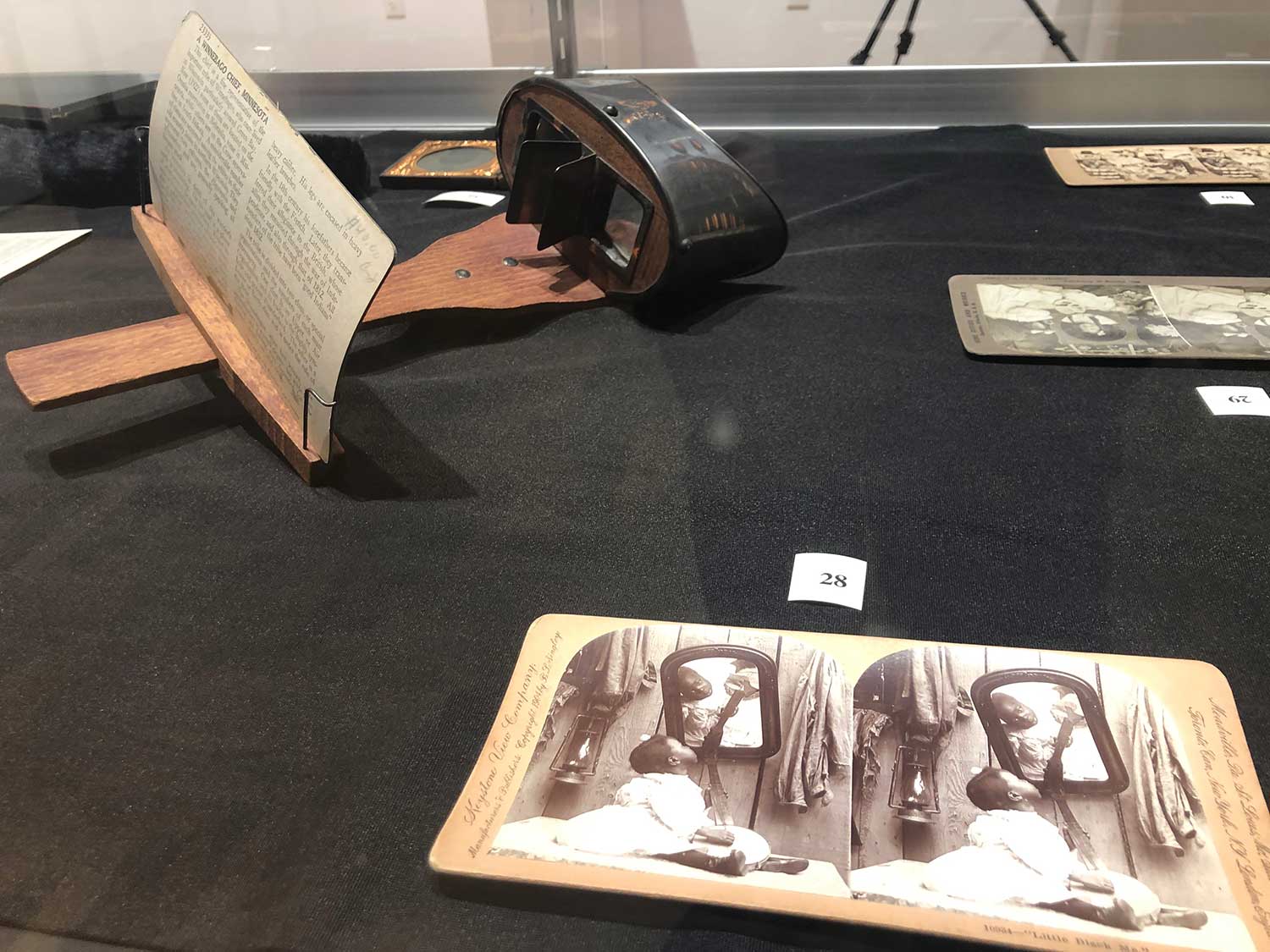 Examples of stereographs and a stereoviewer, a 19th-century technology to view 3-D images